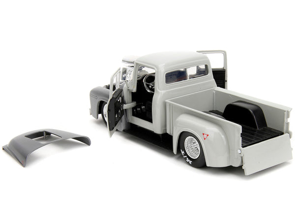Jada 34373 tan and gray 1956 Ford F-100 pickup with Guile figure, Street Fighter, 1:24 truck