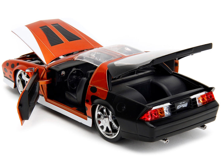 1985 Chevrolet Camaro Z/28 Orange Metallic with Graphics and Chester Cheetah Diecast Figure "Cheetos" "Hollywood Rides" Series 1/24 Diecast Model Car by Jada image 2