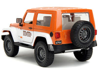 Jada 34401 orange and white 2007 Jeep Wrangler with Orange M&M figure, 1:24 diecast model set