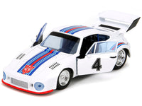 Front three-quarter view of white Transformers Jazz Porsche 935 Turbo with open doors, Jada 34793