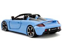 Rear three-quarter view of blue Porsche Carrera GT convertible with closed doors, Jada 35066