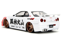 2002 Nissan Skyline GT-R (R34) RHD (Right Hand Drive) White with Red Graphics and Ryu Diecast Figure "Street Fighter" Video Game "Anime Hollywood Rides" Series 1/24 Diecast Model Car by Jada image 2
