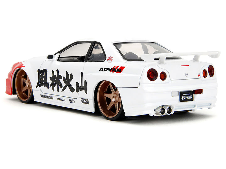 2002 Nissan Skyline GT-R (R34) RHD (Right Hand Drive) White with Red Graphics and Ryu Diecast Figure "Street Fighter" Video Game "Anime Hollywood Rides" Series 1/24 Diecast Model Car by Jada image 2