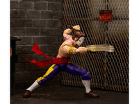 Alternate fighting pose of Vega with extended claw and flowing red sash against a brick backdrop, Jada 35172