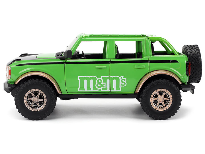 2021 Ford Bronco Green with Black Stripes and Green M&M's Diecast Figure "Hollywood Rides" Series 1/24 Diecast Model Car by Jada image 2