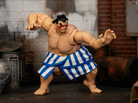 E. Honda action figure with arms raised in styled scenery; scenery is not included, Jada 35740