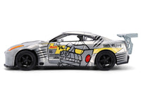 2009 Nissan GT-R (R35) Ben Sopra Brushed Metal with Black Top and Graphics and Mechagodzilla Diecast Figure "Godzilla" Franchise "Anime Hollywood Rides" Series 1/24 Diecast Model by Jada image 3