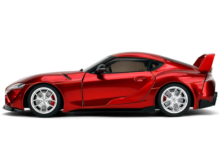 Red metallic Toyota GR Supra, Pink Slips, 1:18, closed side view — Jada 36468