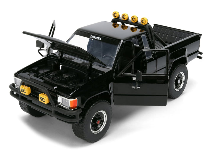 1985 Toyota SR5 Pickup Truck Black with Marty's Skateboard "Back to the Future" (1985) Movie "Hollywood Rides" Series 1/24 Diecast Model Car by Jada image 2