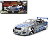 Silver and blue brush-finish Nissan Skyline GT-R R34 with Fast & Furious anniversary packaging, Jada 36818 in 1:24