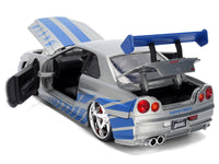 Rear three-quarter view of Jada 36818 Skyline R34 with doors and trunk open