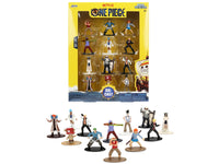 One Piece twelve-figure Metalfigs assortment displayed beside yellow retail packaging, Jada 37363