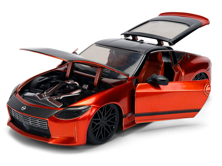 2023 Nissan Z Orange Metallic with Carbon Hood and Black Top "JDM Tuners" Series 1/24 Diecast Model Car by Jada image 2