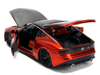 Rear three-quarter view of orange 2023 Nissan Z with doors and hatch open, Jada 37490