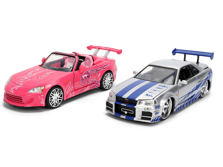 Brian's Nissan Skyline GT-R (R34) Silver Metallic with Blue Stripes and Suki's Honda S2000 Pink with Graphics Set of 2 Cars "Fast & Furious 25th Anniversary" "Fast & Furious" Series 1/24 Diecast Model Cars by Jada image 2