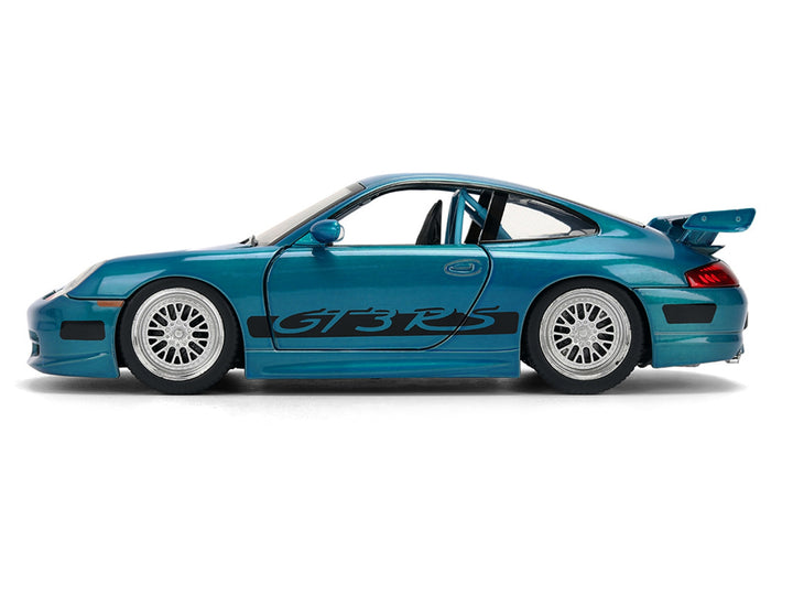 Closed side profile of blue brush-finish Porsche 911 GT3 RS with white wheels and dark side graphics, Jada 37819