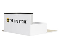 Side view of The UPS Store diorama showing the large wall logo, roof and low side wall; GreenLight 51491, 1:64.