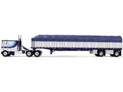 Peterbilt 352 COE 110" Sleeper and 53' Wilson Roadbrute Flatbed Trailer with Covered Wagon White with Blue Stripes 1/64 Diecast Model by DCP/First Gear image 3