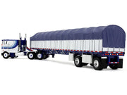 Peterbilt 352 COE 110" Sleeper and 53' Wilson Roadbrute Flatbed Trailer with Covered Wagon White with Blue Stripes 1/64 Diecast Model by DCP/First Gear image 4