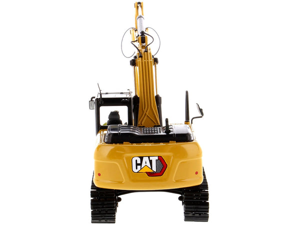 Diecast Masters CAT 323 GX hydraulic excavator with operator 1:50 85675, product image 1