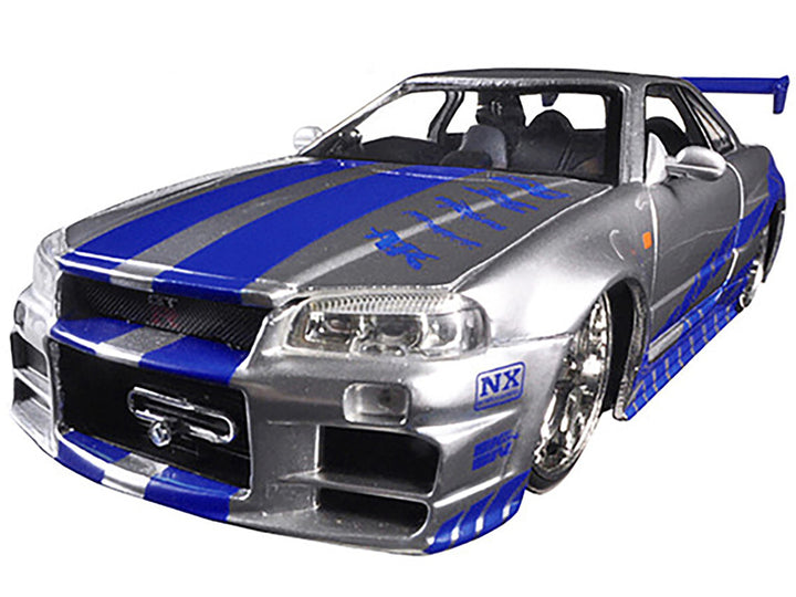 Brian's Nissan GTR Skyline R34 RHD (Right Hand Drive) Silver with Blue Stripes "Fast & Furious 25th Anniversary" 1/24 Diecast Model Car by Jada image 2