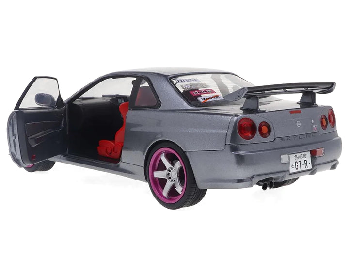 1999 Nissan Skyline GT-R (R34) RHD (Right Hand Drive) Silver Metallic with Purple Wheels 1/18 Diecast Model Car by Solido image 2