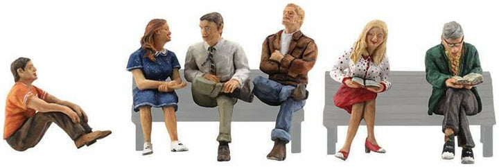 Woodland Scenics A2759 O scale People Sitting, painted miniature set. Benches shown for placement only; not included.