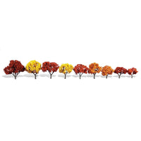 Nine Woodland Scenics TR3540 Harvest Blaze trees displayed separately, showing their varied sizes and fall colors.