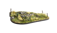 Manufacturer installation example for Woodland Scenics Barbed Wire Fence; base and scenery are separate.