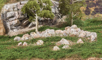 Woodland Scenics C1142 Boulder Ready Rocks, installed landscape example; surrounding scenery is separate.