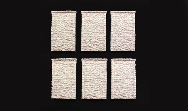 Woodland Scenics C1161 six unpainted random stone retaining-wall sections.