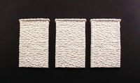 Woodland Scenics C1261 HO scale random-stone retaining walls, three unpainted wall sections.