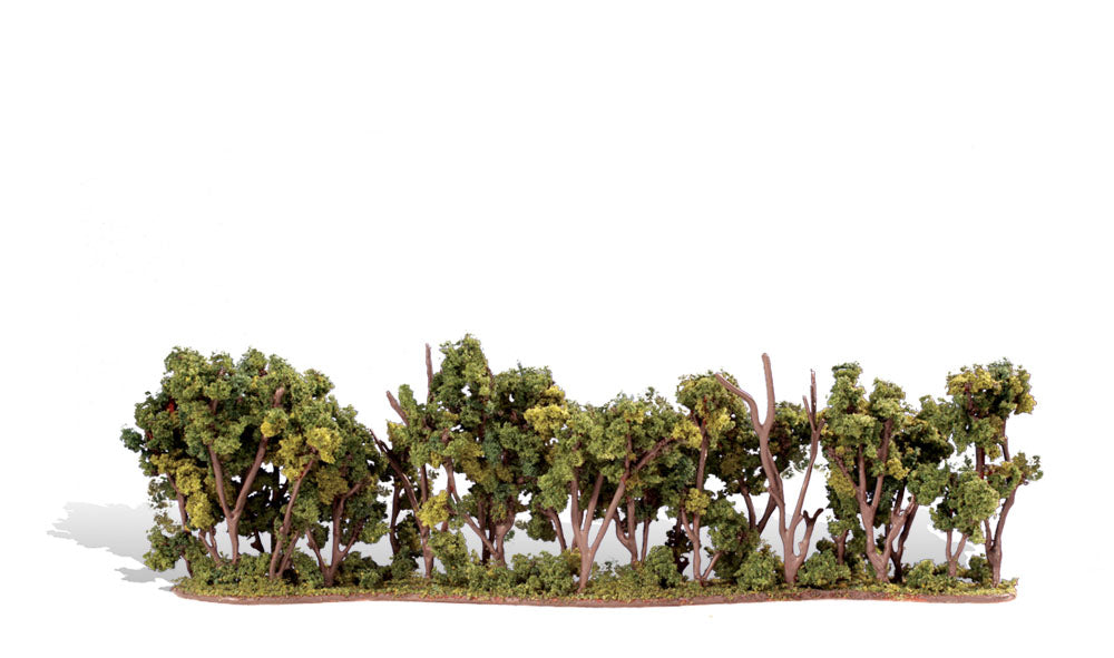 Woodland Scenics TR3581 Hedgerow showing leafy bushes and exposed branches on one scenic strip.