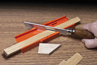 Zona 35-251 mini miter box and razor saw demonstrated cutting wood at an angle.