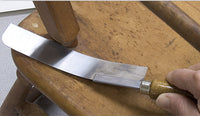Zona 35-400 flush-cut saw demonstrated trimming a wooden dowel flush to a surface.