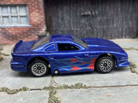 Loose Hot Wheels Ford Mustang Cobra, blue flame graphics, view 1