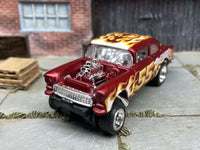 Side view of satin-red 1955 Chevy Gasser custom Hot Wheels with chrome race wheels