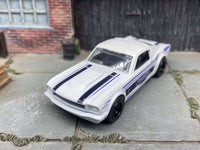 1965 Ford Mustang Fastback custom, Detroit white and blue, black wheels, view 2