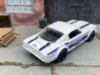 1965 Ford Mustang Fastback custom, Detroit white and blue, black wheels, view 4