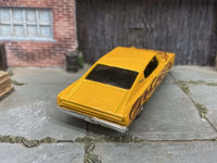 Yellow 1967 Dodge Charger custom Hot Wheels with flame graphics, view 2