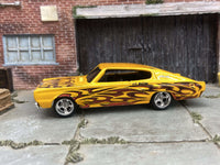 Yellow 1967 Dodge Charger custom Hot Wheels with flame graphics, view 4