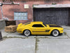 Custom Hot Wheels 1969 Ford Mustang Boss 302 In Yellow and Black With Chrome 4 Spoke Wheels With Rubber Tires
