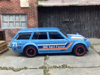 Rear three-quarter view of Datsun 510 Wagon custom Hot Wheels with rubber tires