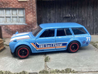 Front three-quarter view of light-blue-and-white 1971 Datsun 510 Wagon custom Hot Wheels