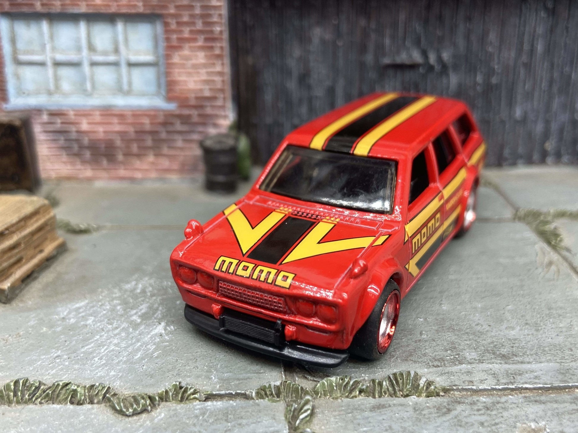Custom Hot Wheels 1971 Datsun 510 Wagon In MOMO Red Yellow Black With Chrome and Red 4 Spoke Race Wheels With Rubber Tires
