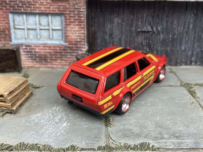 Custom Hot Wheels 1971 Datsun 510 Wagon In MOMO Red Yellow Black With Chrome and Red 4 Spoke Race Wheels With Rubber Tires