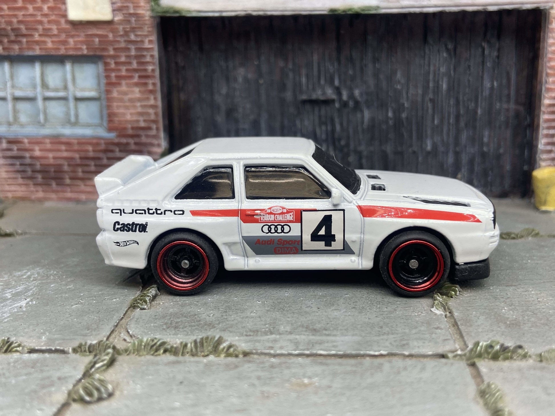 Custom Hot Wheels 1984 Audi Sport Quatro In White Red and Green Livery With Black and Red 4 Spoke Race Wheels With Rubber Tires