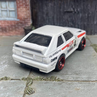 Custom Hot Wheels 1984 Audi Sport Quatro In White Red and Green Livery With Black and Red 4 Spoke Race Wheels With Rubber Tires