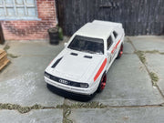 Custom Hot Wheels 1984 Audi Sport Quatro In White Red and Green Livery With Black and Red 4 Spoke Race Wheels With Rubber Tires