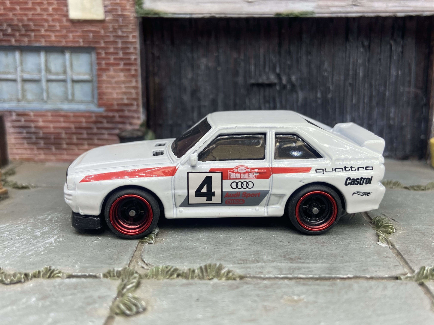 Custom Hot Wheels 1984 Audi Sport Quatro In White Red and Green Livery With Black and Red 4 Spoke Race Wheels With Rubber Tires